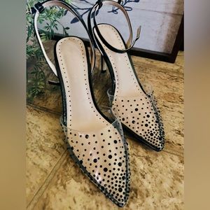 Studded black/clear heels.